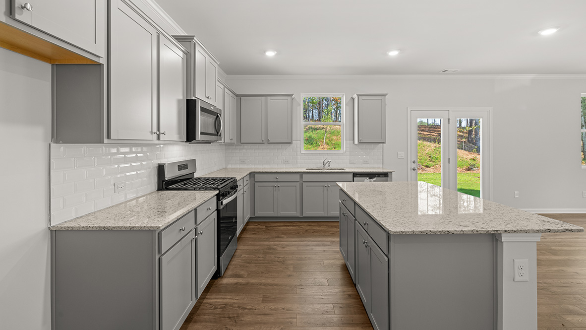 Interior kitchen with center island and light grey cabinets