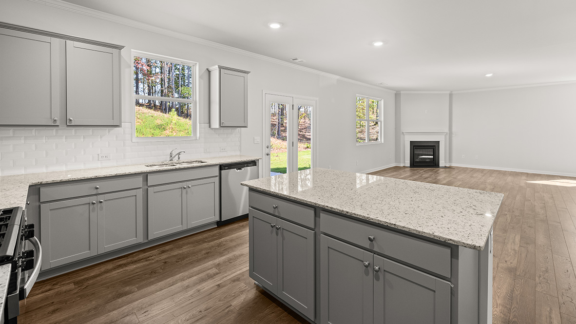 Interior kitchen with center island and light grey cabinets