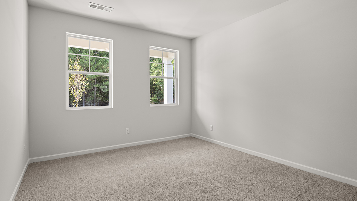 Interior bedroom with two windows