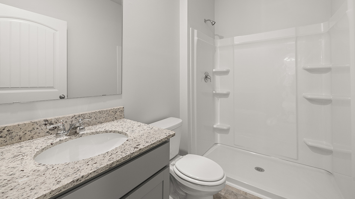 Interior bathroom with sink and full-sized shower