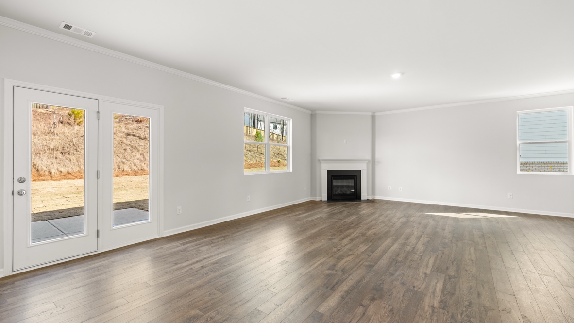 Interior living area with fire place and windows