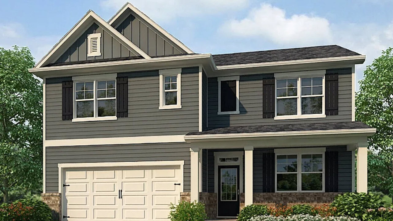 Exterior two-story home with cladding and stone detailing