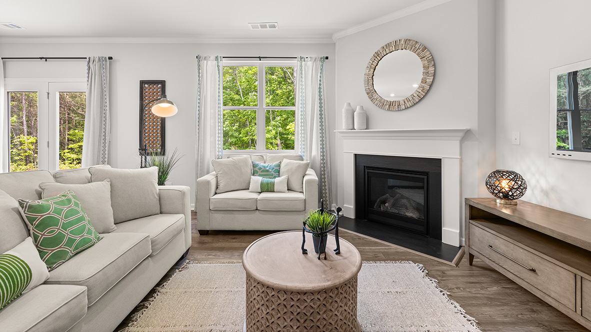 Interior living area with fire place and large window
