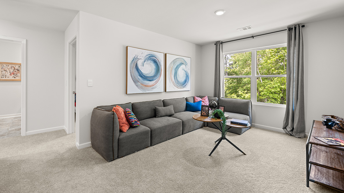 Interior upstairs loft area with large window