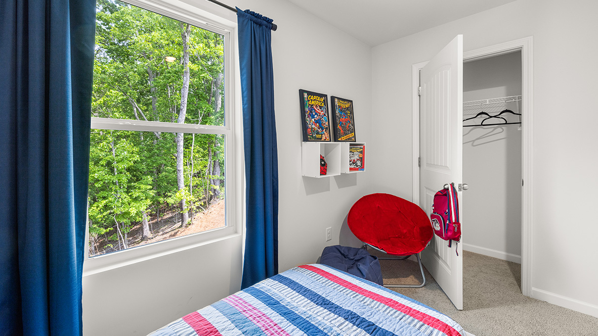 Interior bedroom with large window and closet