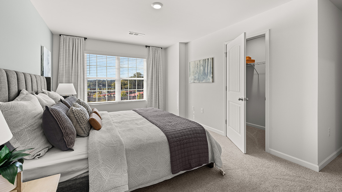 Interior primary bedroom with large window