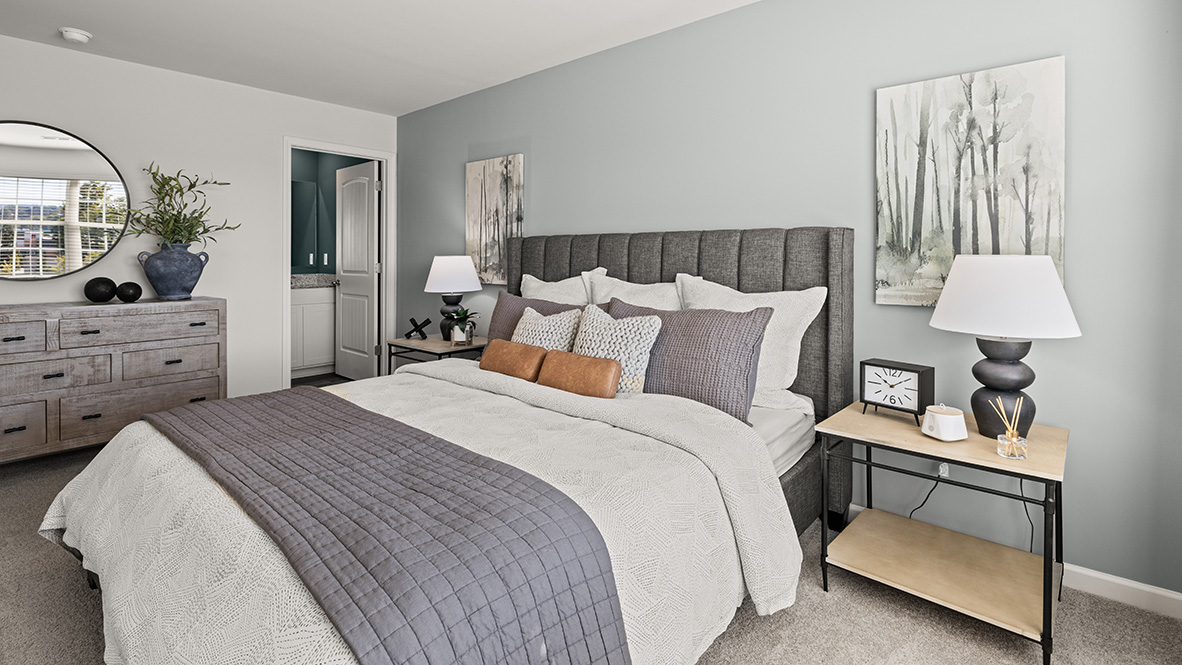 Interior primary bedroom with large window
