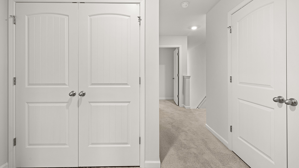 Interior upstairs loft area with hall closet