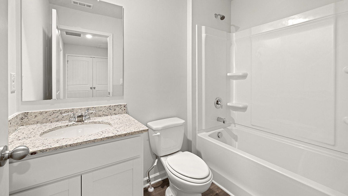 Interior bathroom with sink and full-sized shower
