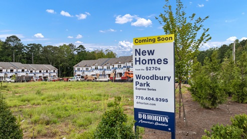 Exterior view of homes and new homes sign