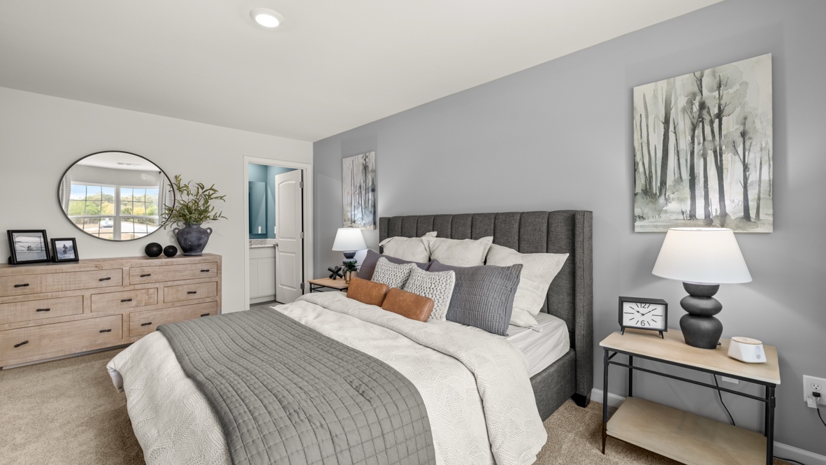 Interior primary bedroom with large window