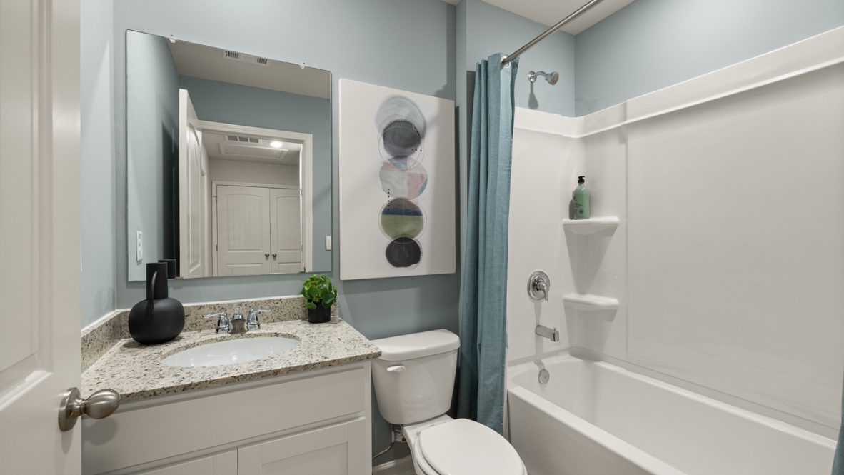 Interior bathroom with sink and full-sized shower