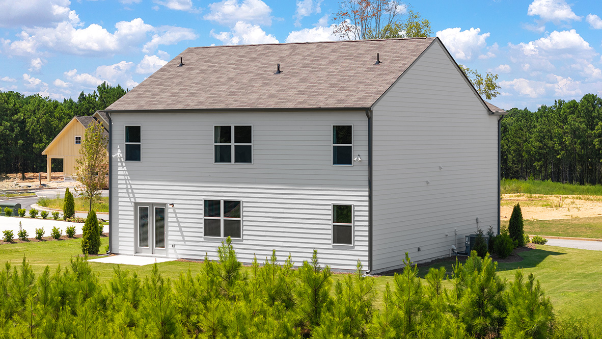 back exterior of the hayden model at oaks at cedar grove in fairburn, ga