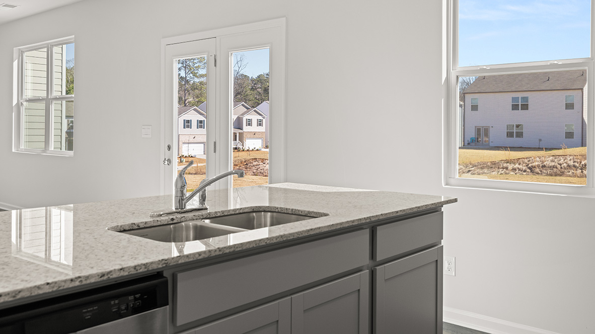 Interior kitchen with center island and light grey cabients