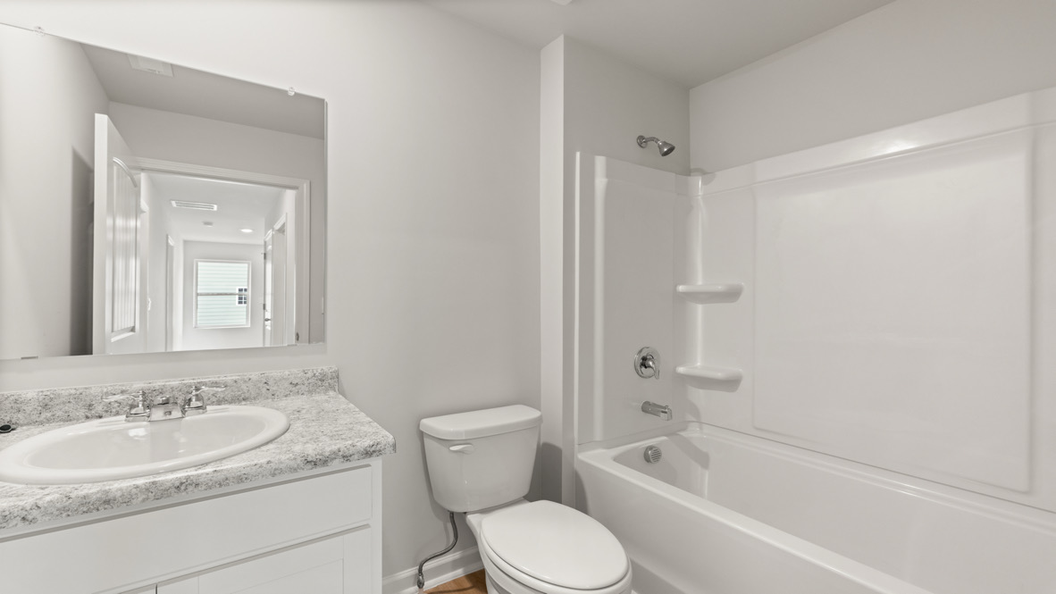 Interior bathroom with sink and full-sized shower