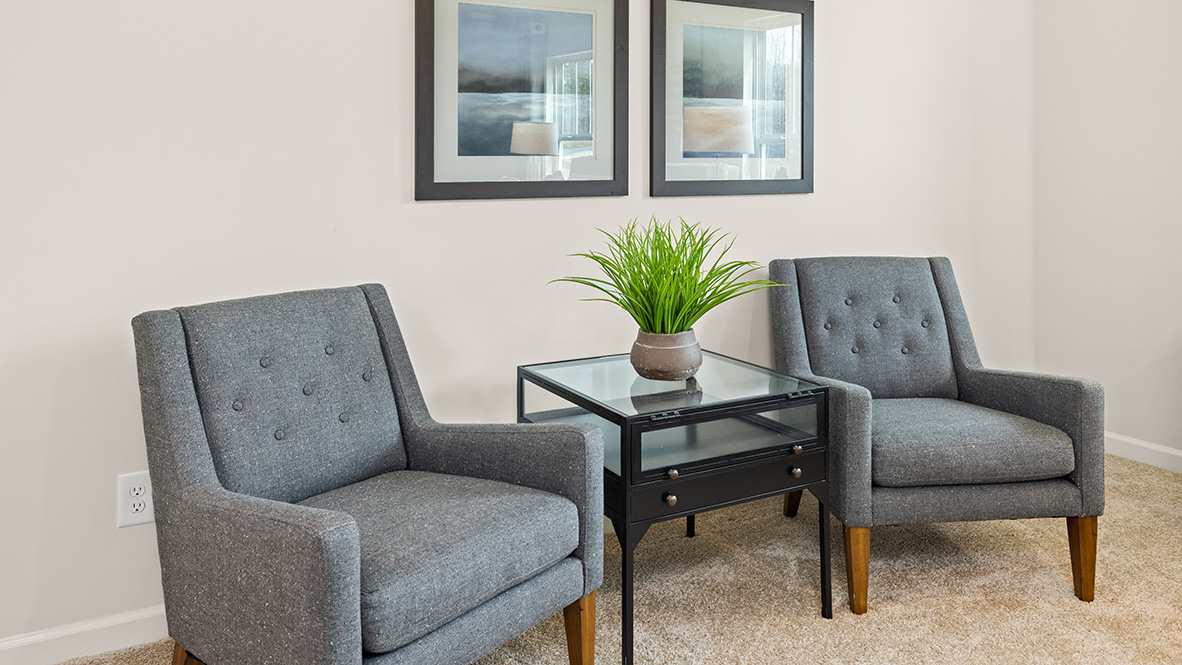 Interior primary bedroom with large windows
