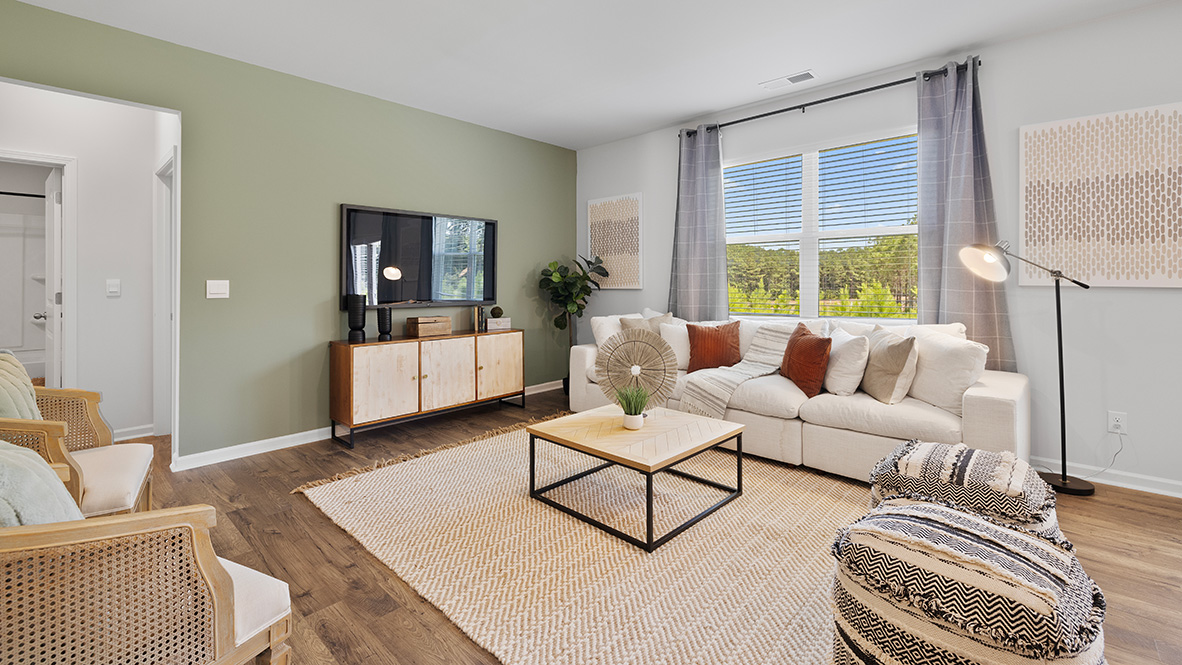 Interior living area with large window and accent wall