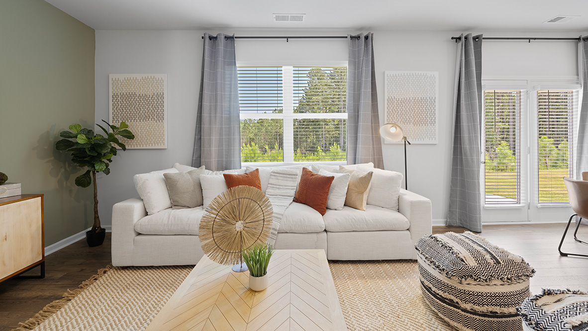 Interior living area with large windows and accent wall