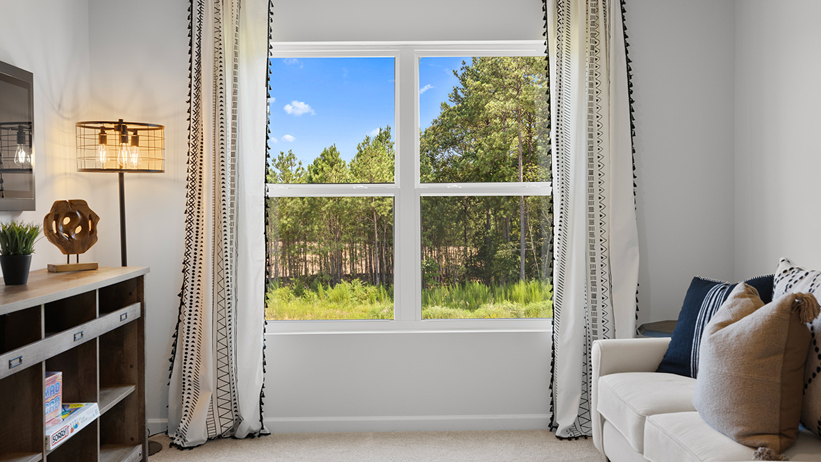 Interior upstairs loft area with large window
