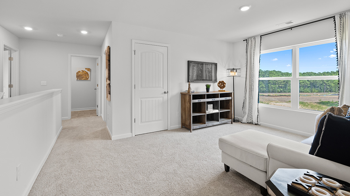 Interior upstairs loft area with large window