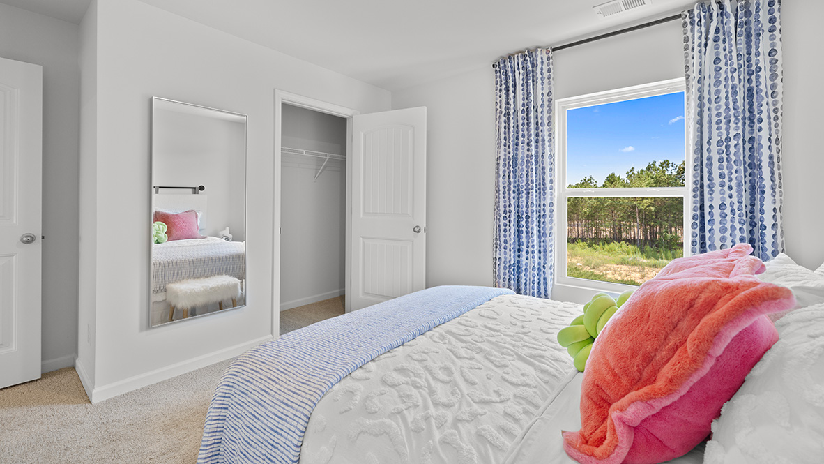Interior bedroom with window and closet