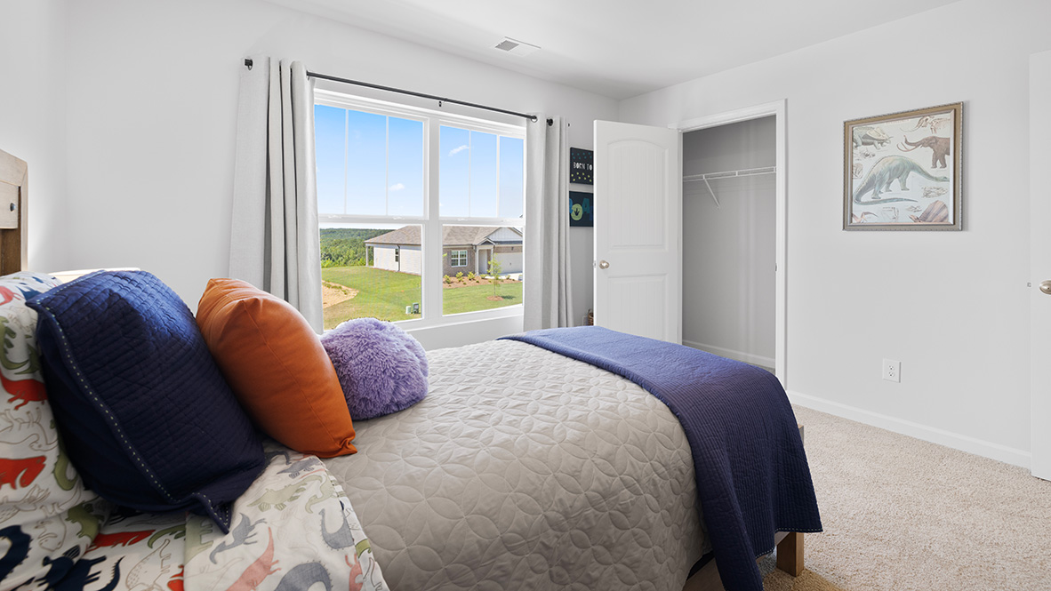 Interior bedroom with window and closet