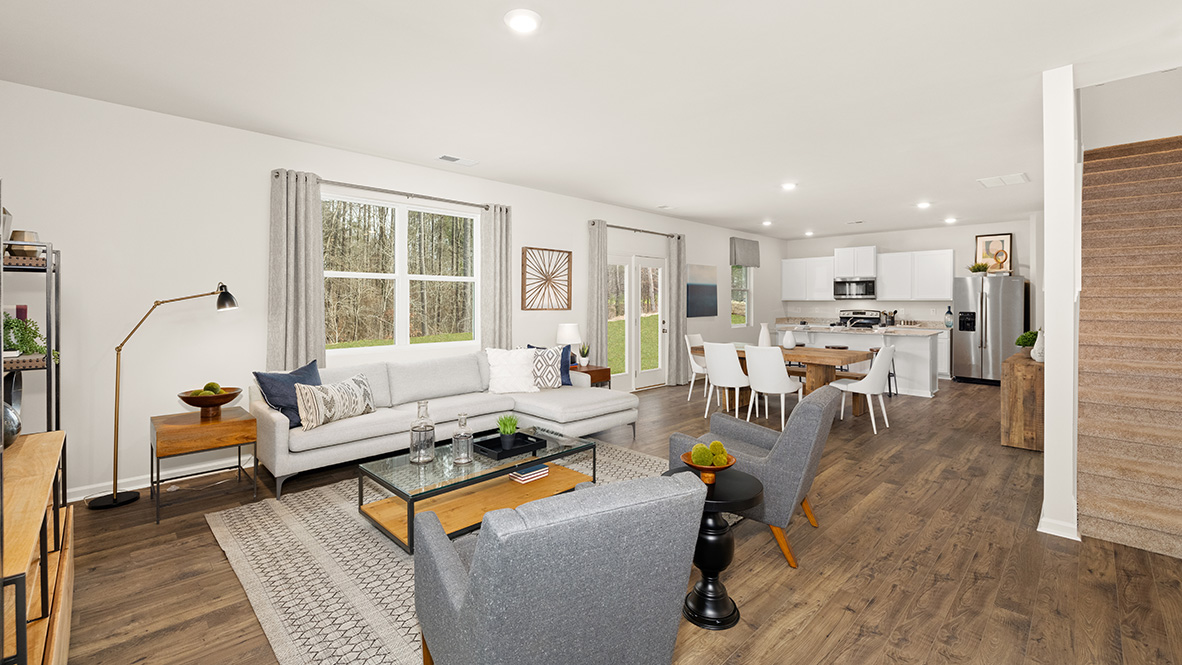 Interior living area open to dining area and kitchen