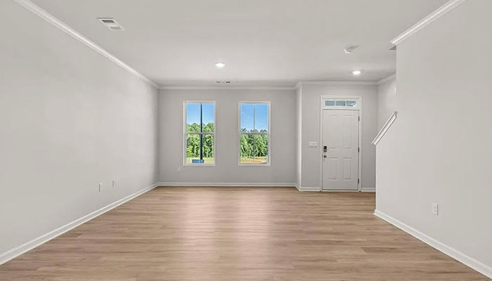 Interior living area with large windows open to staircase