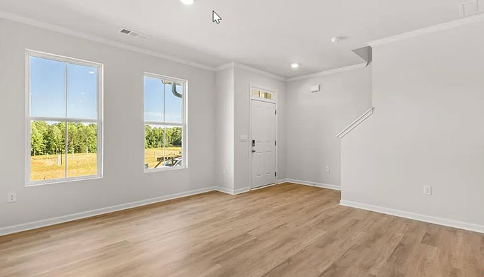 Interior living area with large windows open to staircase