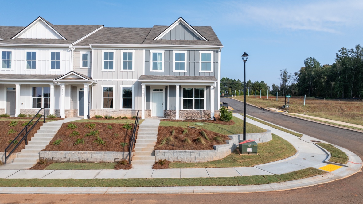 Exterior townhomes with cladding and stone detailing