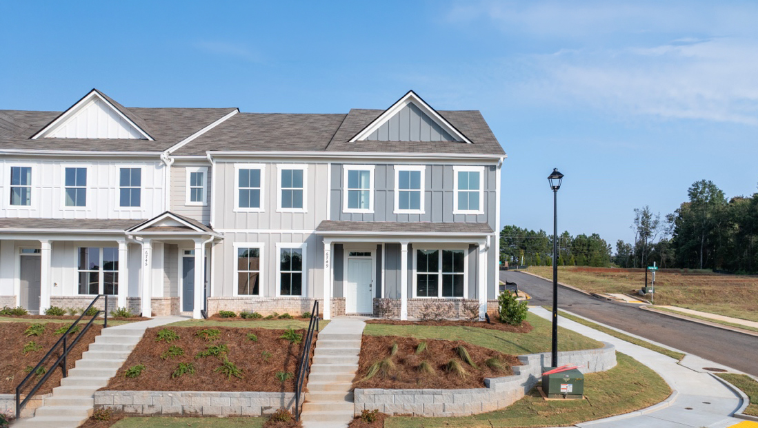 front exterior of townhomes with multi color siding