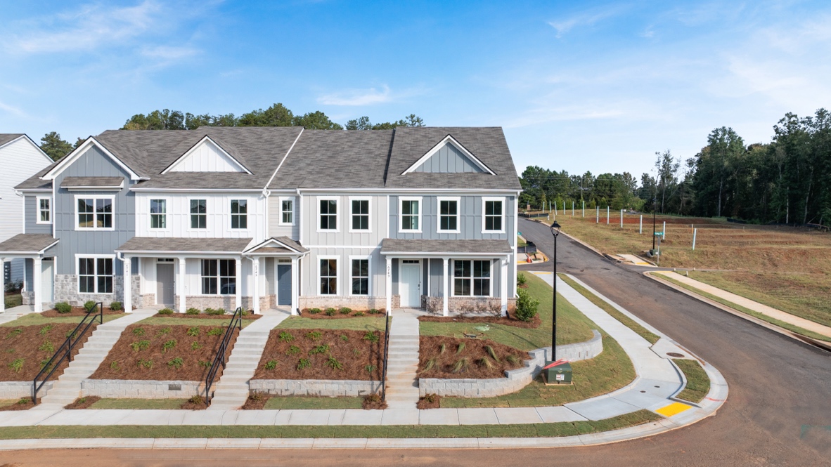 front exterior of townhomes with multi color siding