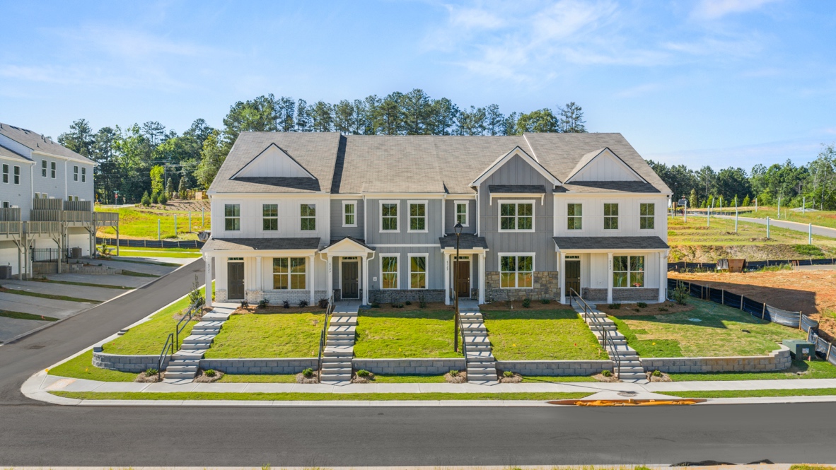 front exterior of townhomes with multi color siding