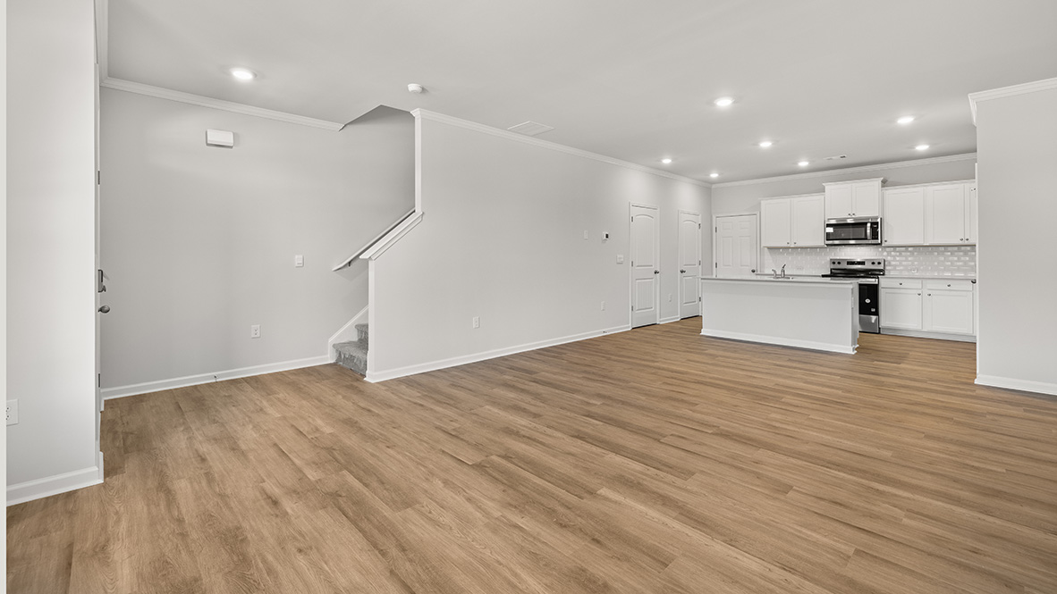 Open concept first floor with the living room, dining room and kitchen next to each other