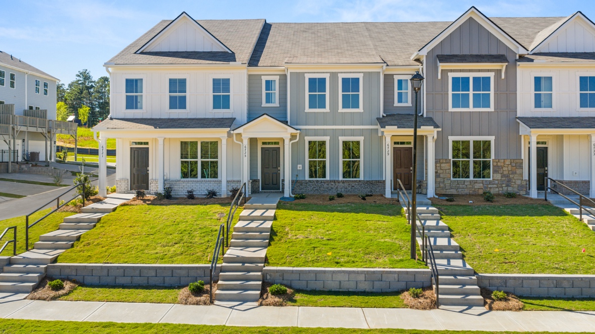 front exterior of townhomes with multi color siding