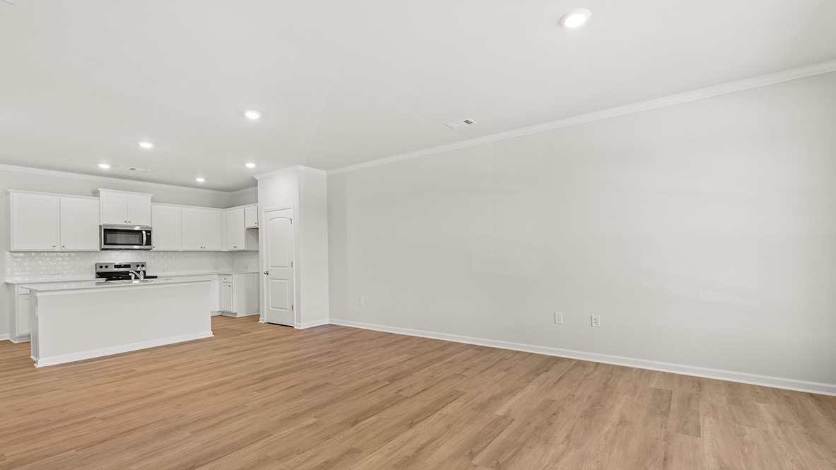 Open concept first floor with the living room, dining room and kitchen next to each other