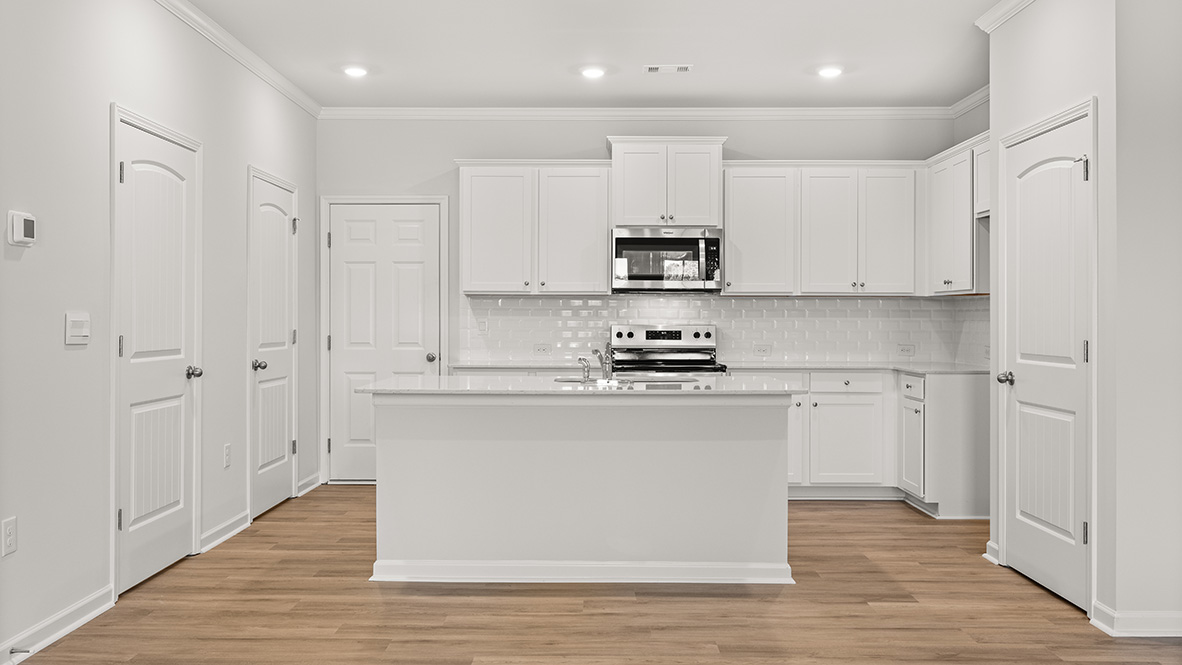 kitchen with white cabinetry, large island and stainless steel appliances
