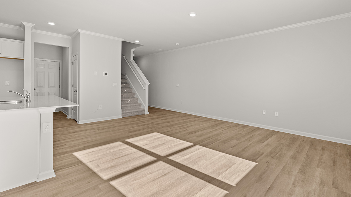 spacious living area featuring light brown floors