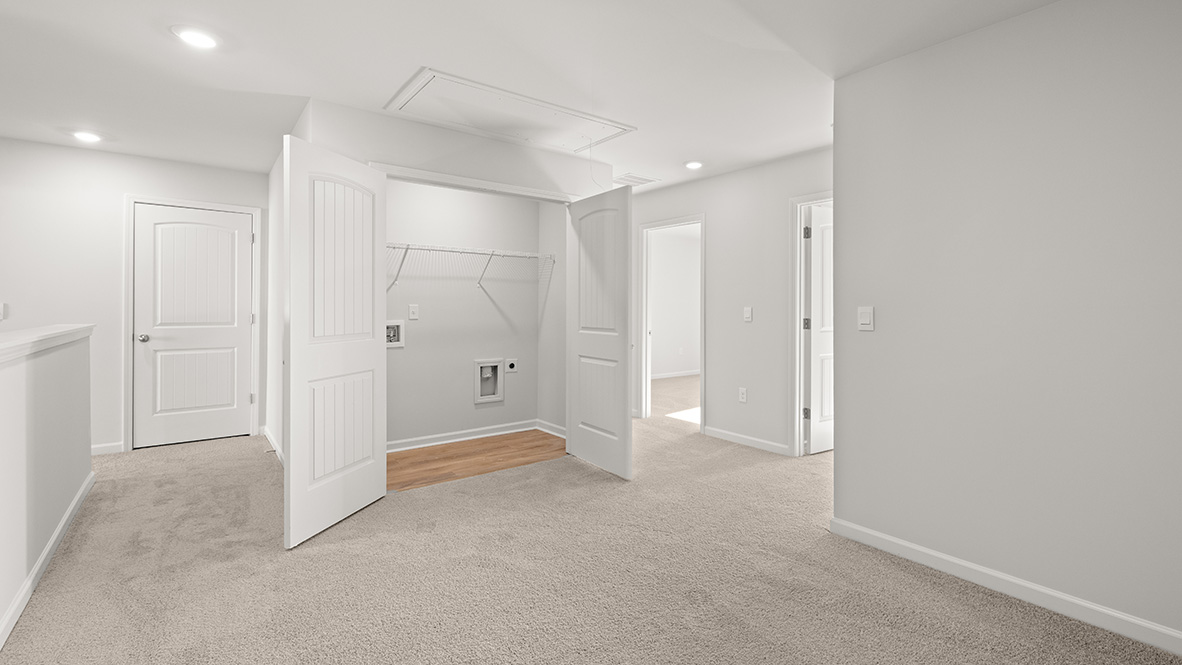 Interior upstairs loft area open to staircase