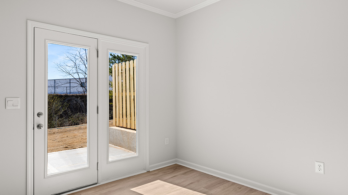 Interior dining area next to back patio doors
