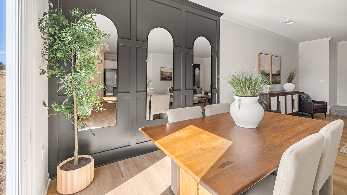 dining room featuring a wooden table and 4 upholstered chairs around it