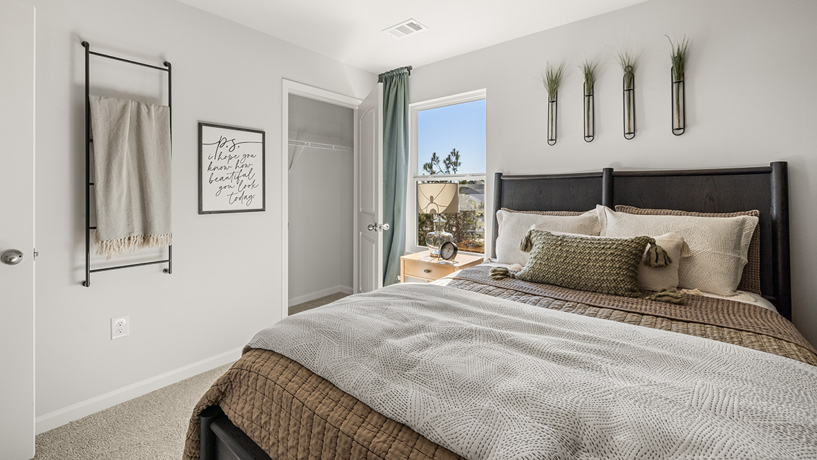 bedroom featuring a crib and rocking chair
