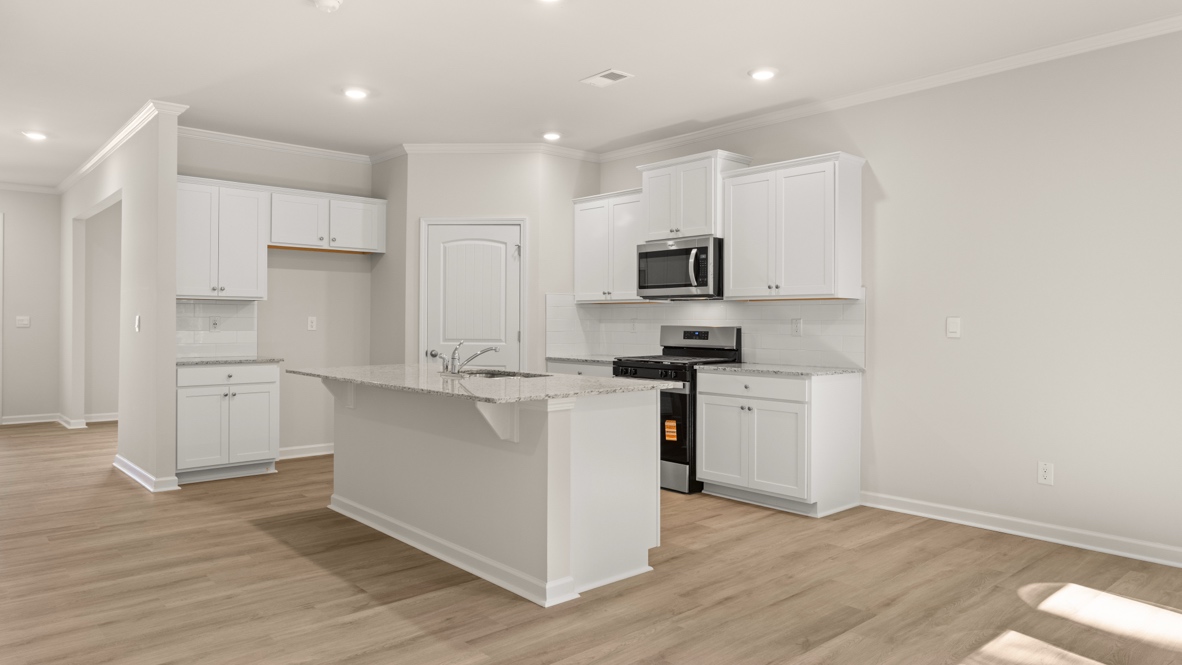 Interior kitchen with center island with white cabinets