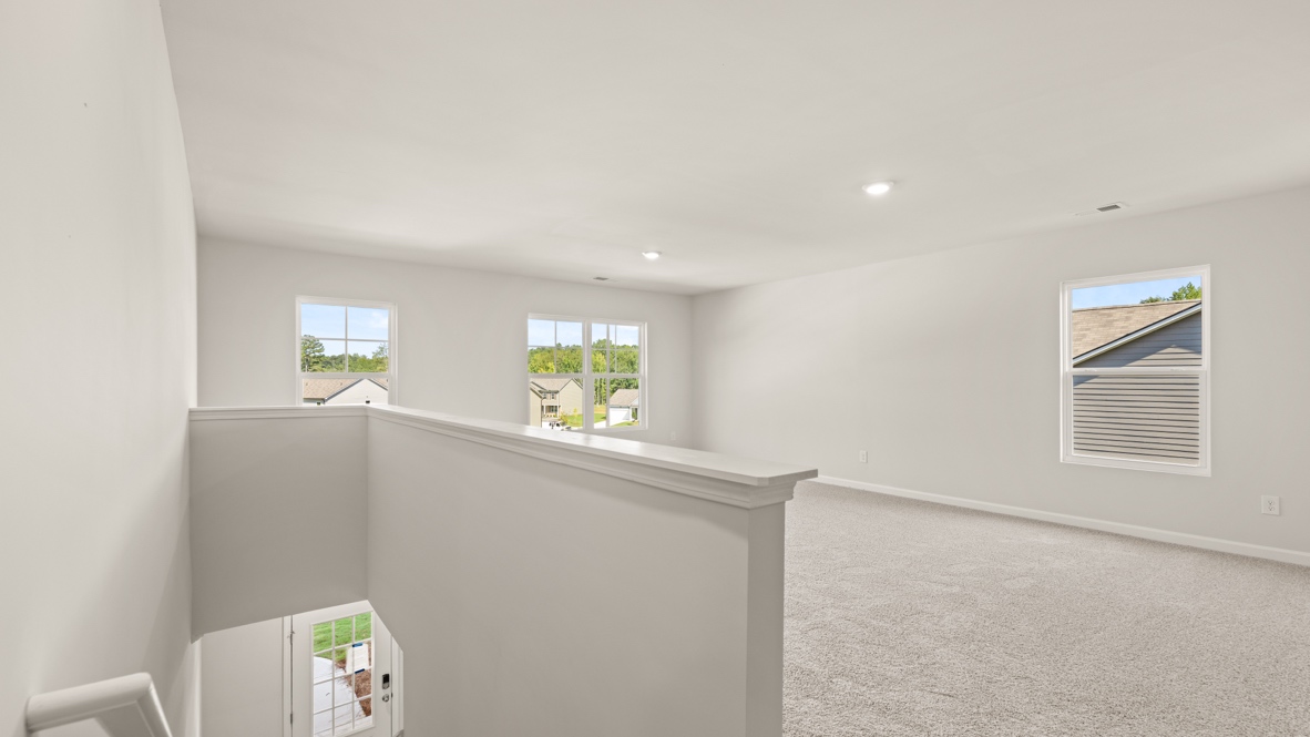 Interior upstairs loft area with windows