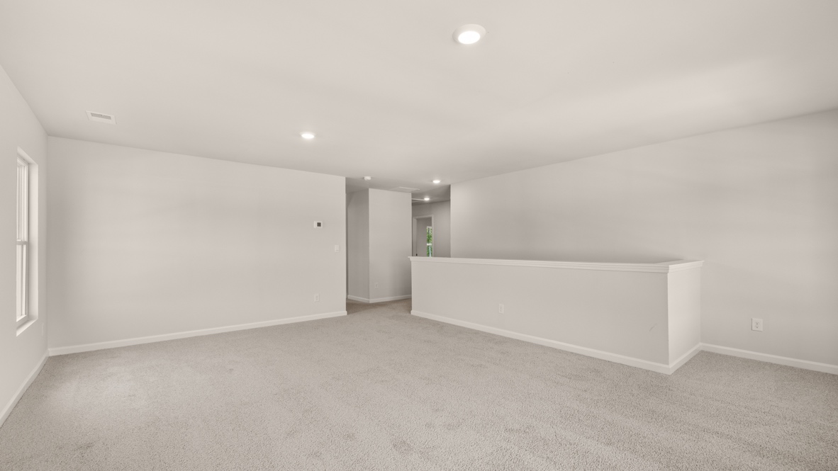 Interior upstairs loft area with windows