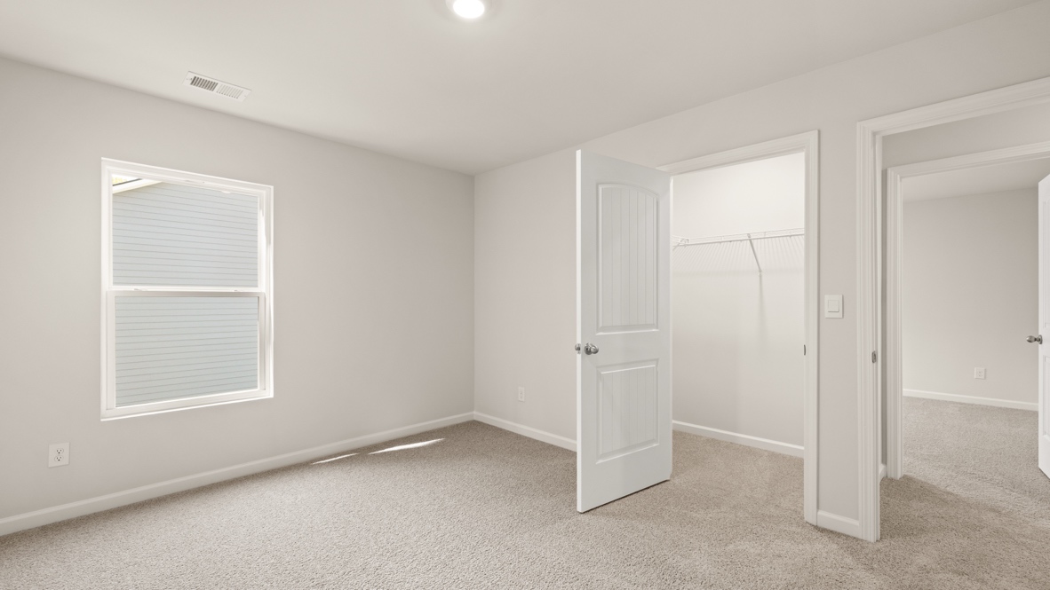 Interior bedroom with window and closet