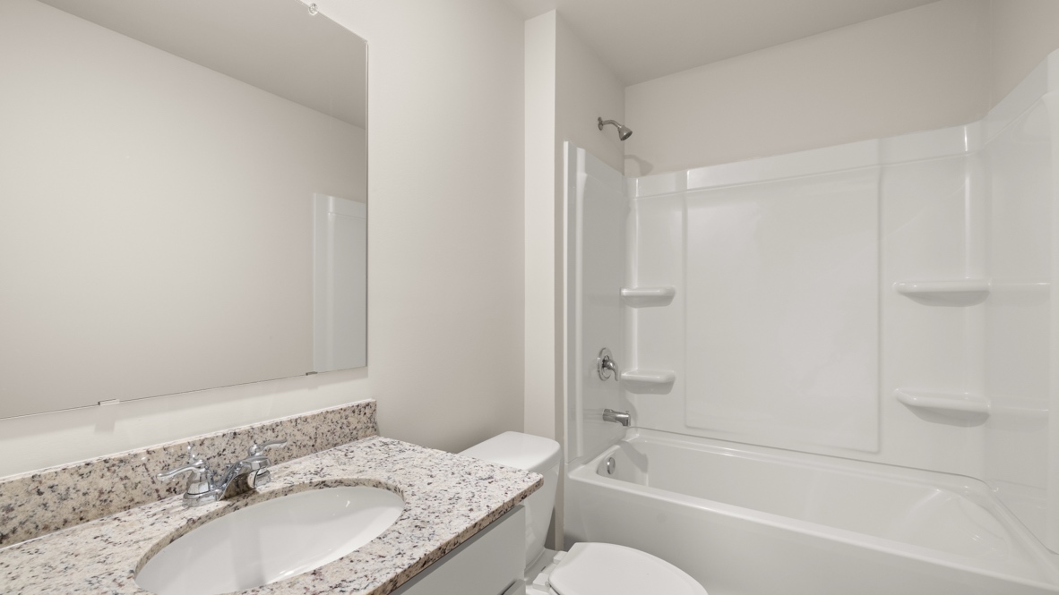 Interior bathroom with sink and full-sized shower