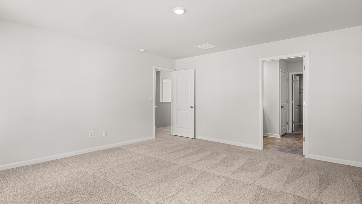 View from bedroom 1 of the ensuire bathroom and the entrance to the hallway.