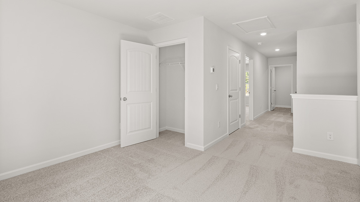 Lovt area view of the hallway and the bedrooms.