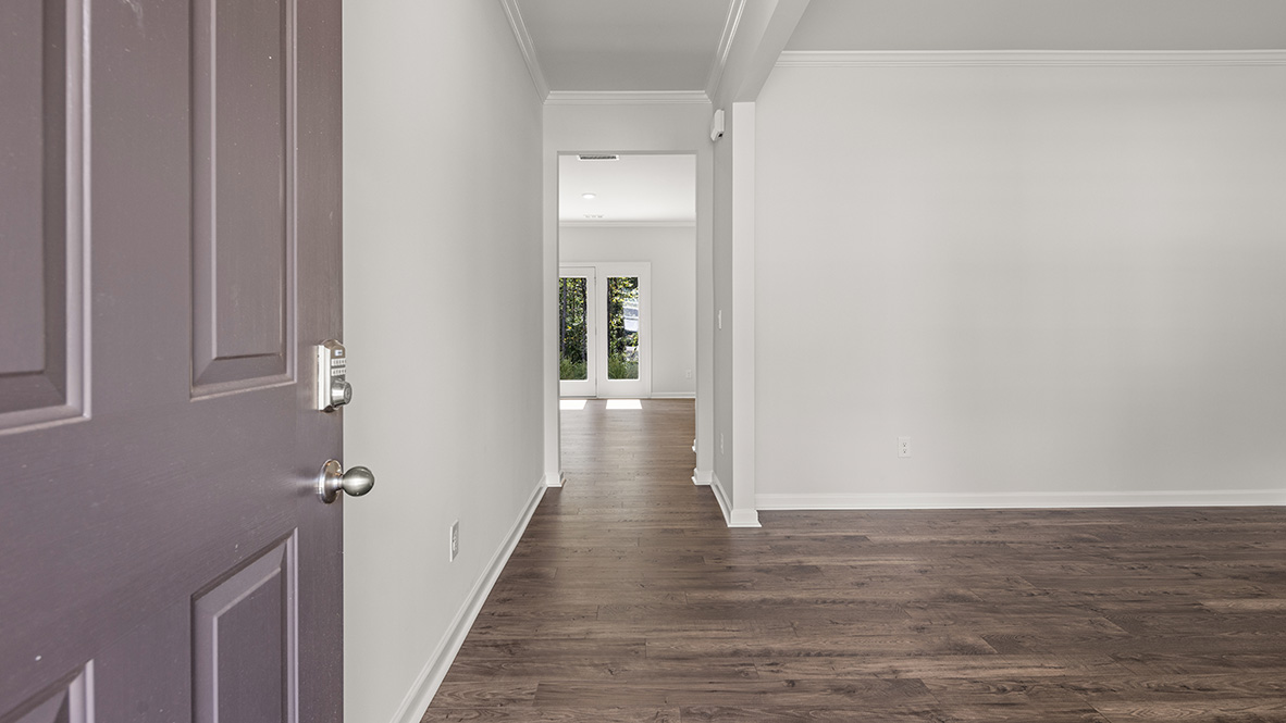 View from the entrance showing the flex room and the glass back doors.